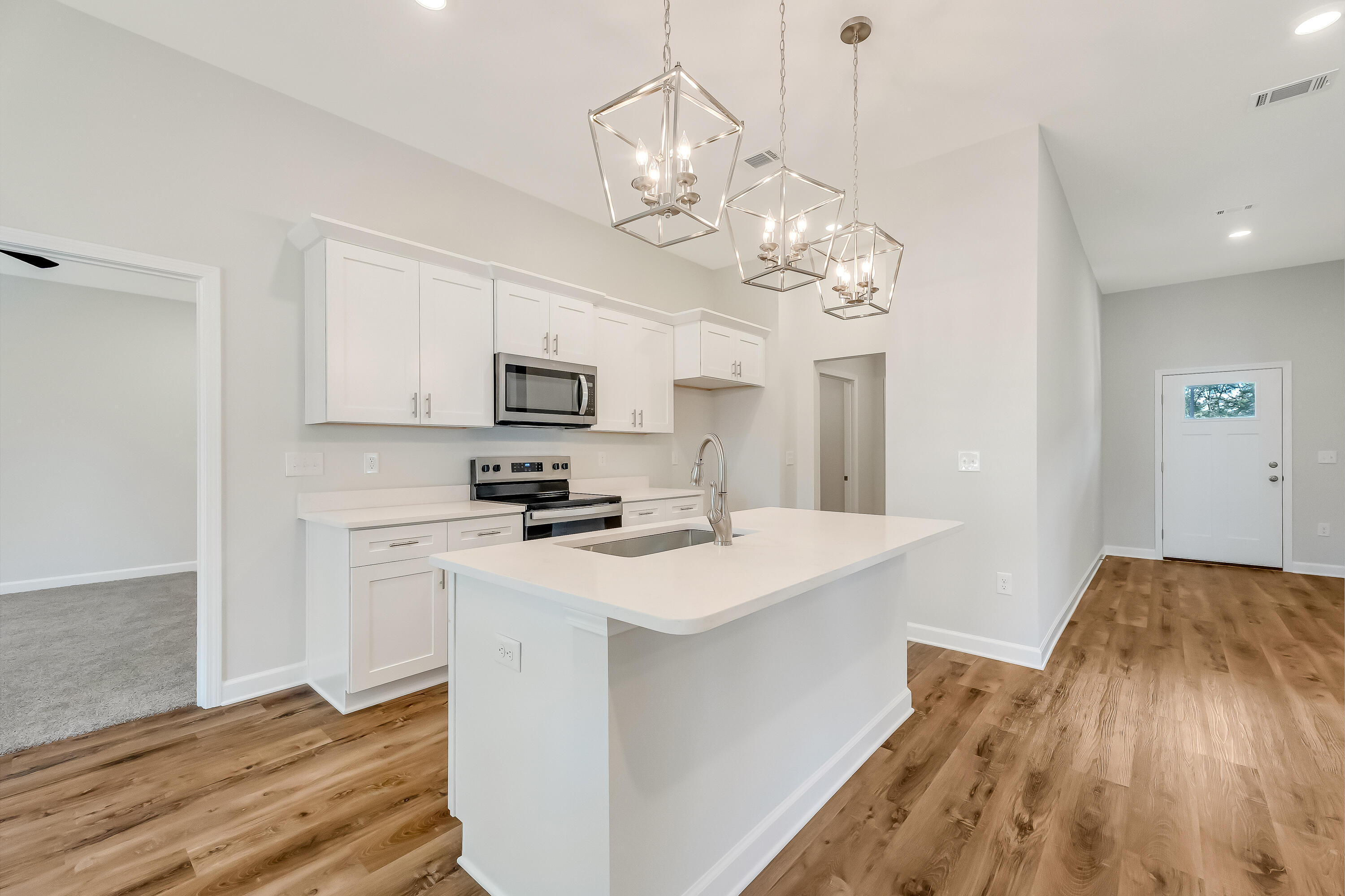 108 Huron Trail Crestview, FL 32536 - Photo 8 of 21 a kitchen that has a lot of white cabinets and stainless steel appliances