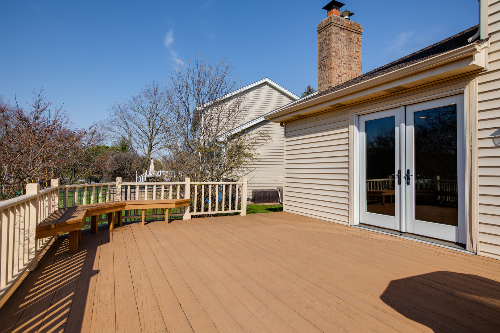 27W337 Churchill Road Winfield, IL 60190 - Photo 4 of 25 a view of a house with wooden deck and a floor to ceiling window