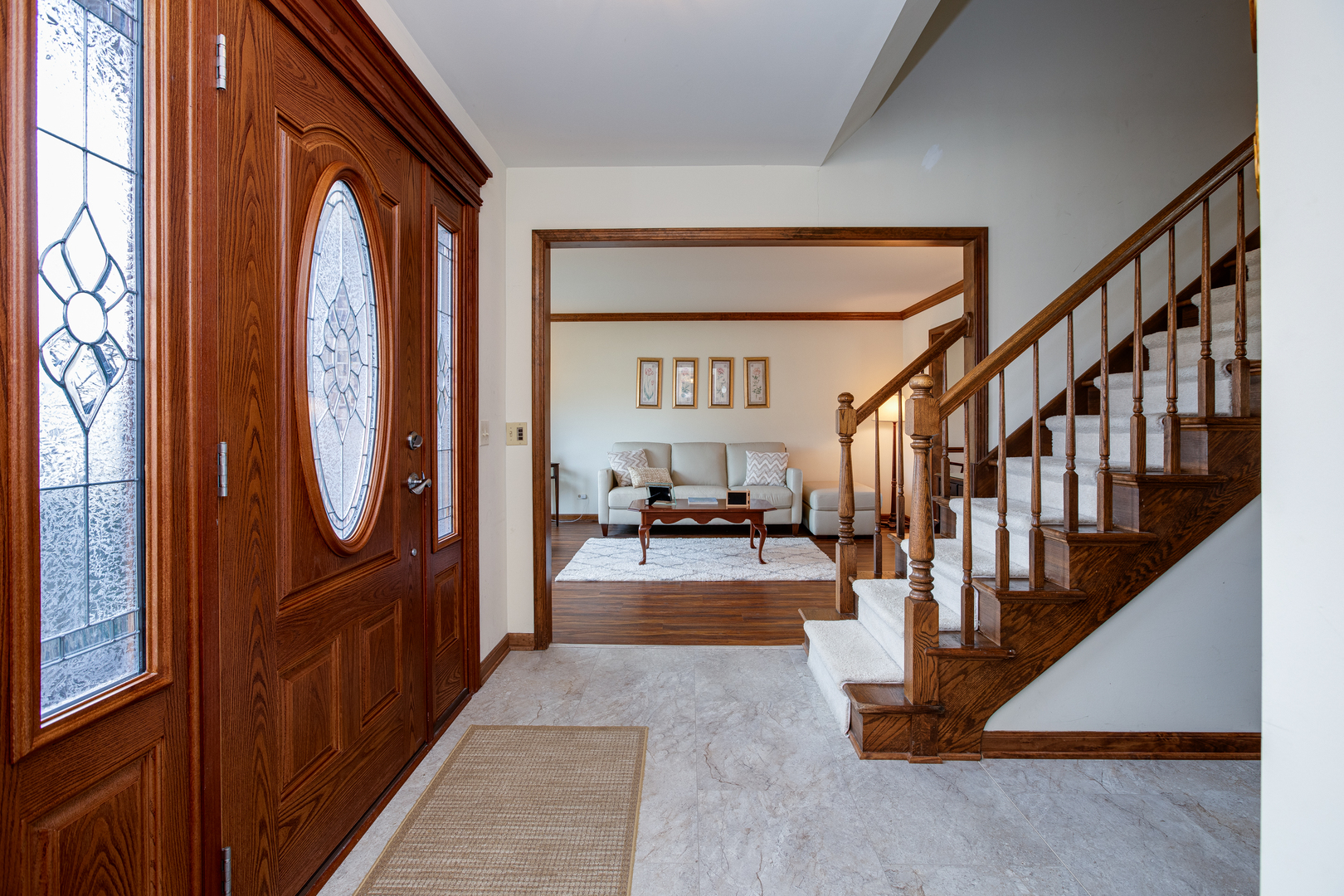27W337 Churchill Road Winfield, IL 60190 - Photo 5 of 25 a view of an entryway with wooden floor and stairs