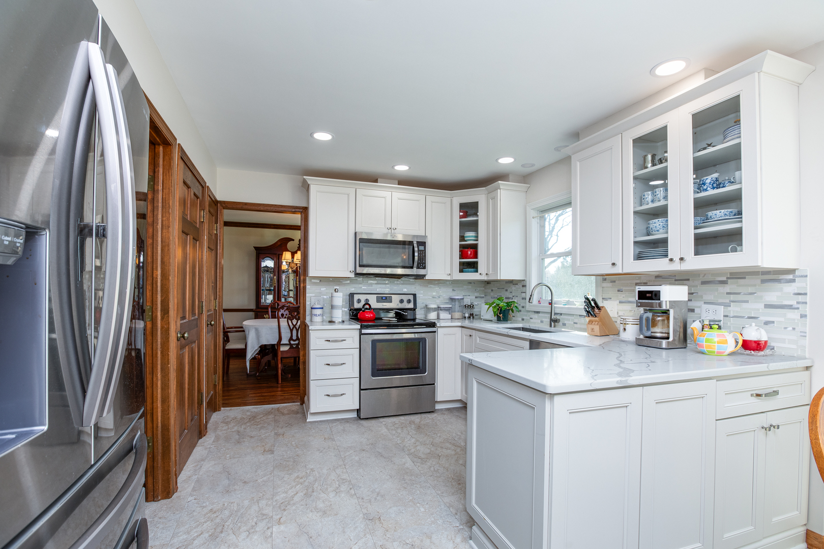 27W337 Churchill Road Winfield, IL 60190 - Photo 9 of 25 a kitchen with cabinets and stainless steel appliances