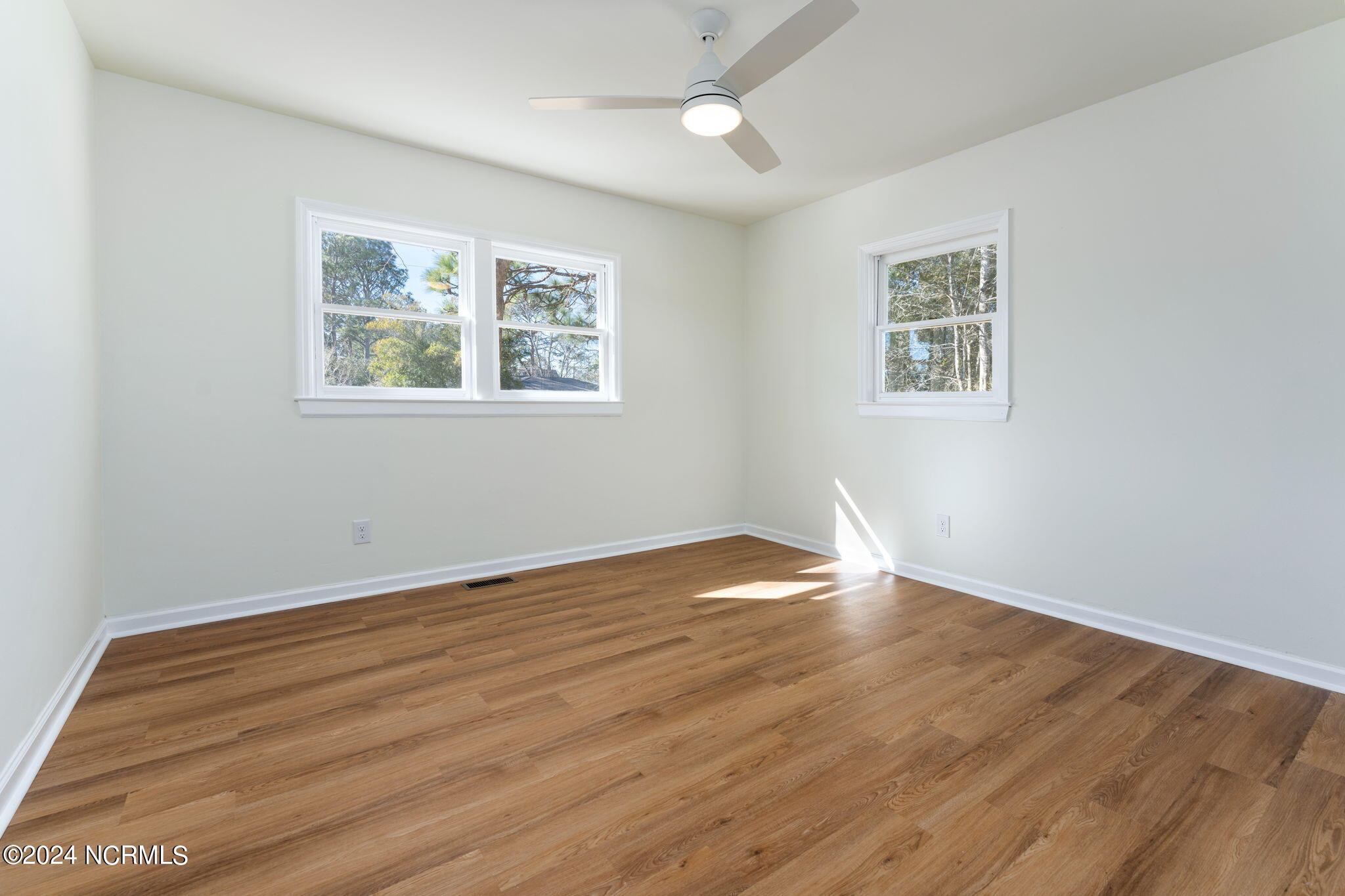229 2 Chopt Road Wilmington, NC 28405 - Photo 43 of 73 Bedroom 2. Remote white fan.