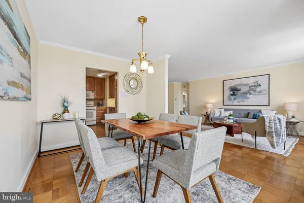 a view of a dining room that has a table and chairs
