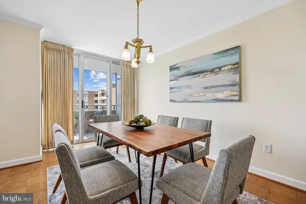 a view of a dining room with furniture window and wooden floor