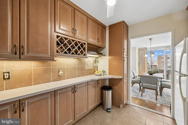 a kitchen with a sink cabinets and window