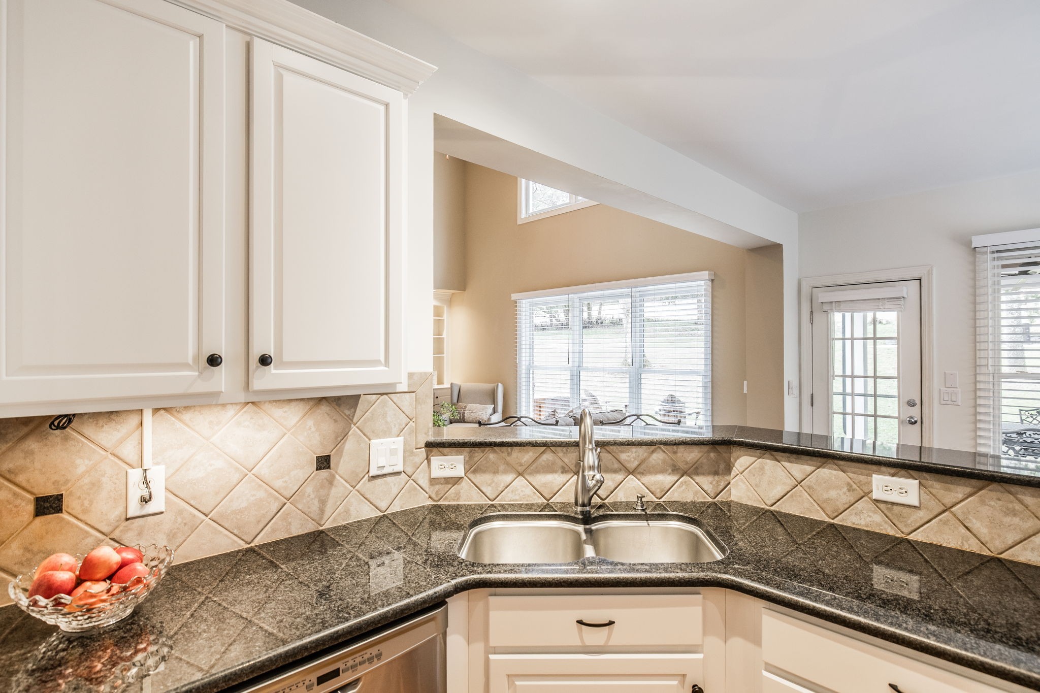 124 Joshuas Run Goodlettsville, TN 37072 - Photo 16 of 60 a kitchen with granite countertop a sink and a white wooden cabinets