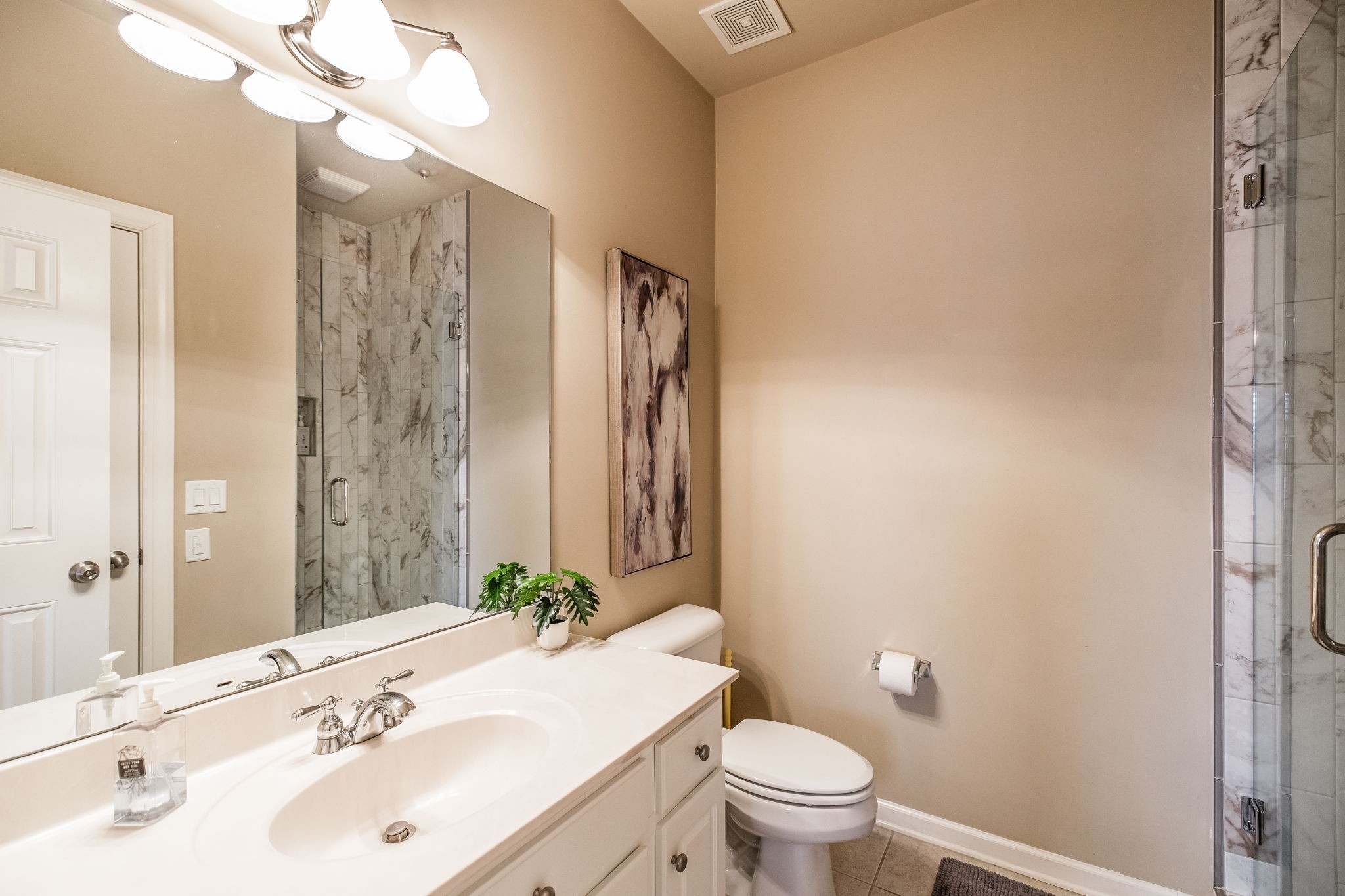 124 Joshuas Run Goodlettsville, TN 37072 - Photo 32 of 60 a bathroom with a sink a toilet and shower
