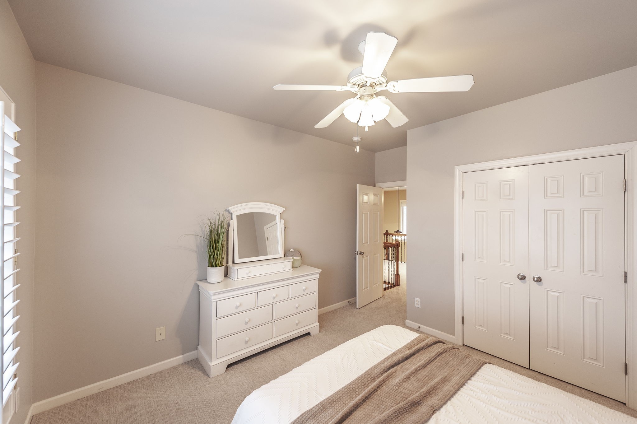 124 Joshuas Run Goodlettsville, TN 37072 - Photo 37 of 60 a bedroom with a white bed and a chandelier