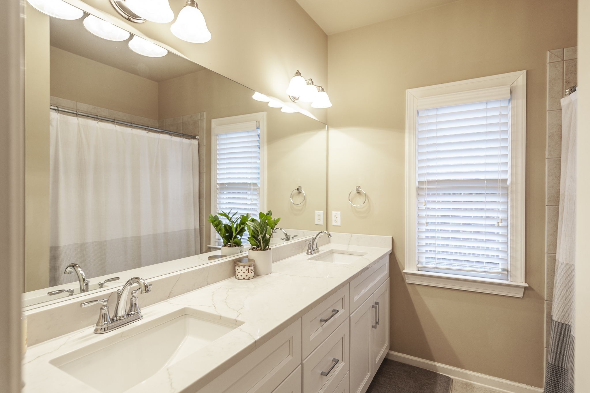 124 Joshuas Run Goodlettsville, TN 37072 - Photo 38 of 60 a bathroom with a double vanity sink and a mirror