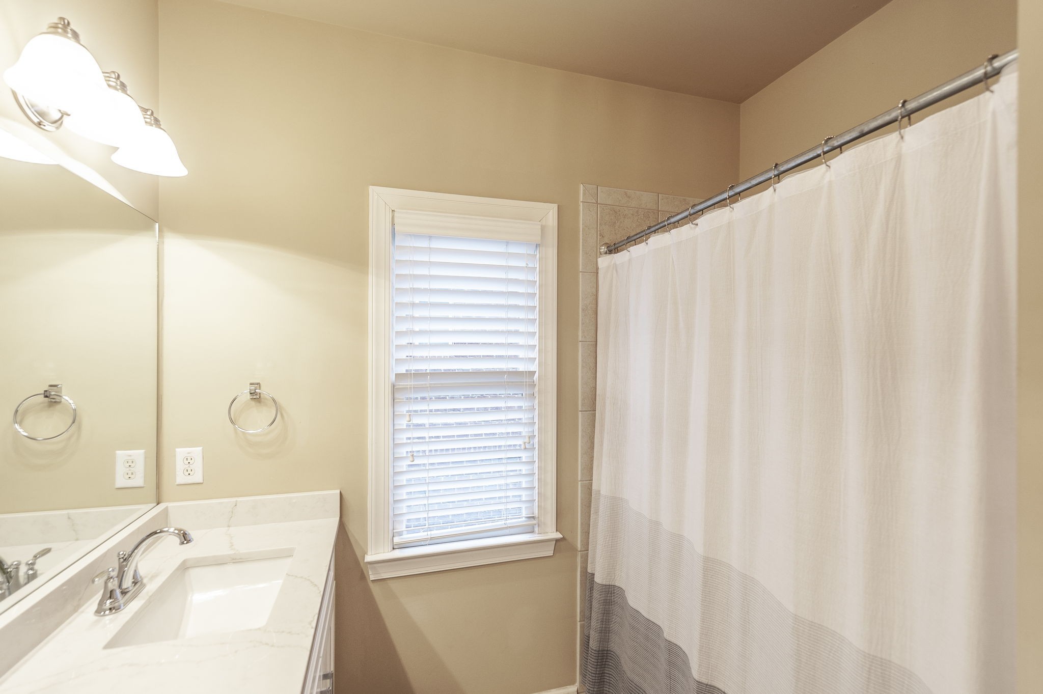 124 Joshuas Run Goodlettsville, TN 37072 - Photo 39 of 60 a bathroom with a sink a mirror and a shower