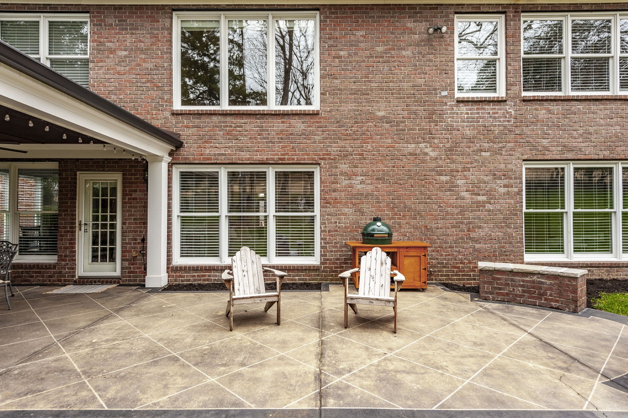 124 Joshuas Run Goodlettsville, TN 37072 - Photo 46 of 60 a bench is sitting in front of a brick building