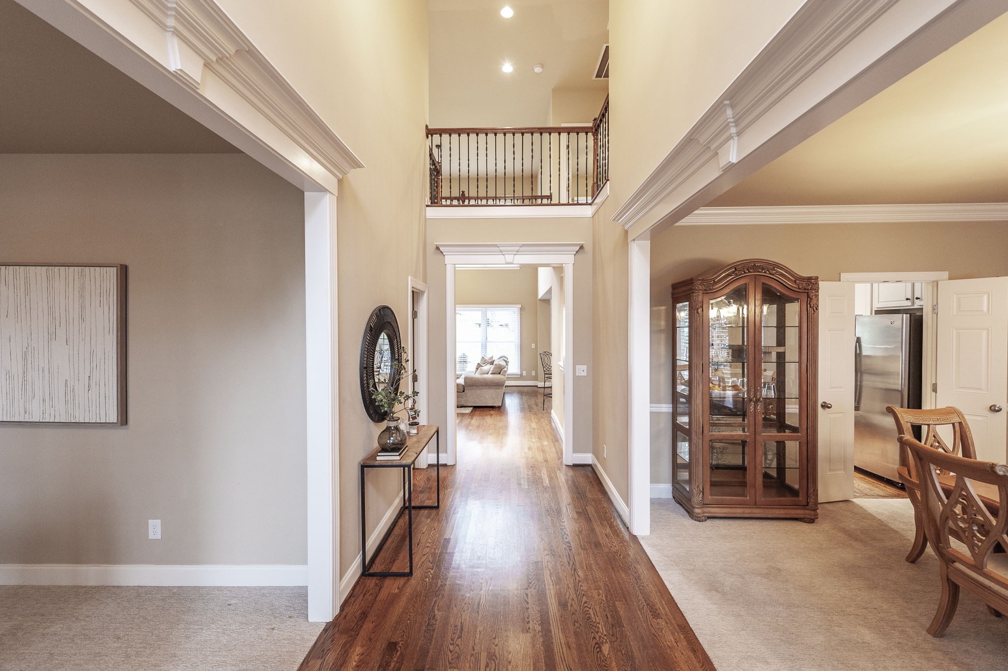 124 Joshuas Run Goodlettsville, TN 37072 - Photo 5 of 60 a view of a hallway with wooden floor and furniture