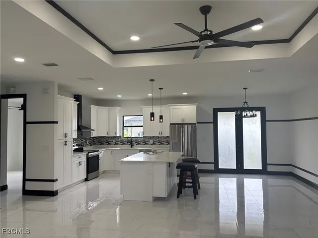 a kitchen with a refrigerator a sink dishwasher a stove and a oven