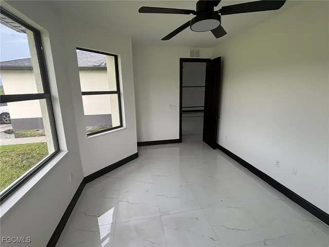 an empty room with windows