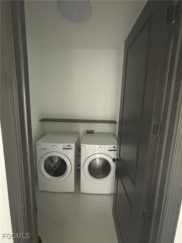 a utility room with dryer and washer