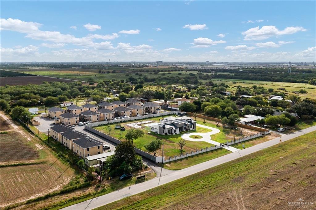 1426 East Rogers Road, Unit 19 Edinburg, TX 78542 - Photo 2 of 13 Aerial view of sparsely populated area with nearby suburban area