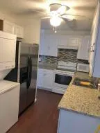 a kitchen with a stove and a refrigerator