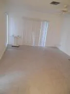 a view of an empty room and a window