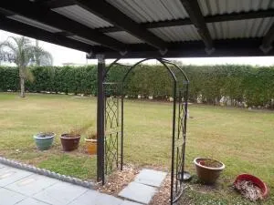 a view of a patio with a table and chairs