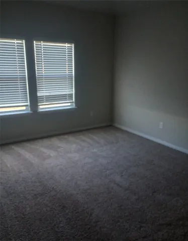 a house view with swimming pool in front of it