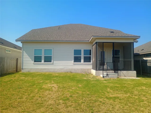 a view of a balcony with wooden fence