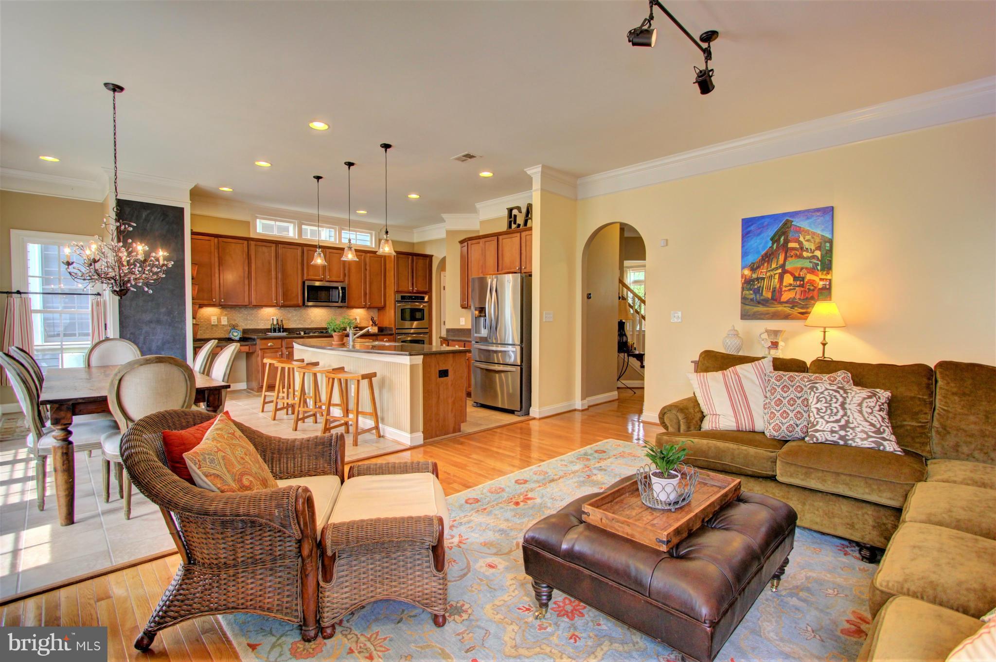 7709 Elmwood Road Fulton, MD 20759 - Photo 11 of 30 a living room with furniture kitchen view and a chandelier