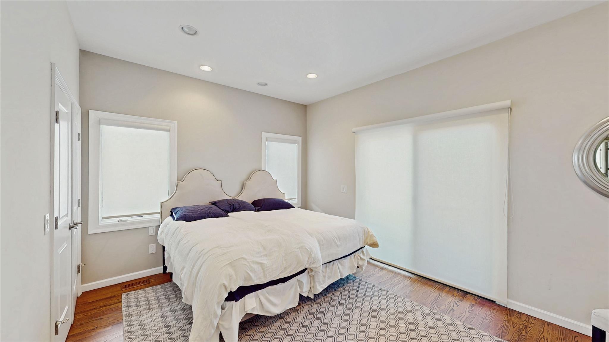 339 Midwood Road Woodmere, NY 11598 - Photo 24 of 49 a bedroom with a bed and a table