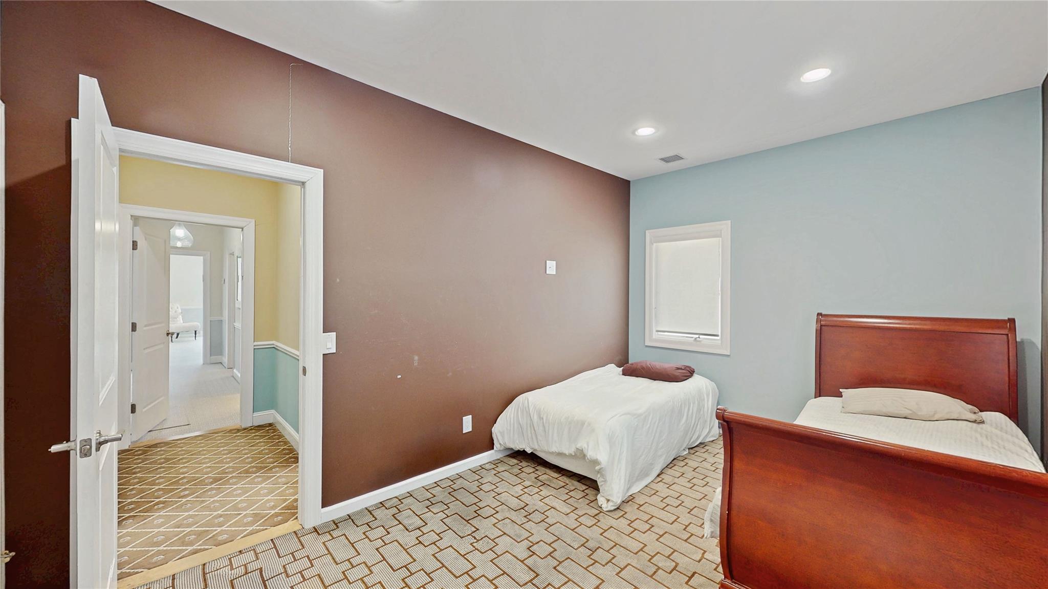 339 Midwood Road Woodmere, NY 11598 - Photo 29 of 49 a bedroom with a bed and wooden floor