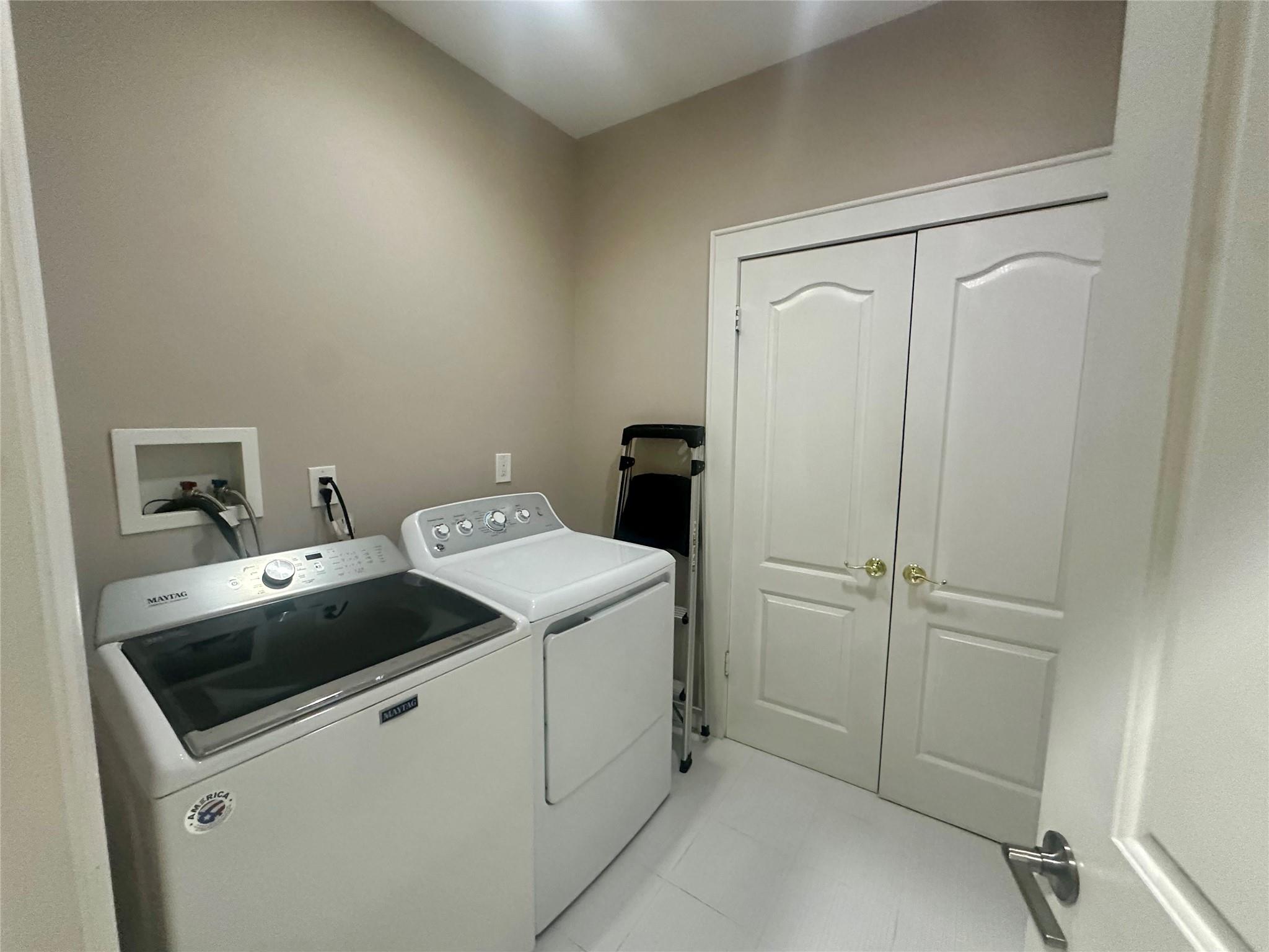 339 Midwood Road Woodmere, NY 11598 - Photo 32 of 49 a utility room with dryer and washer