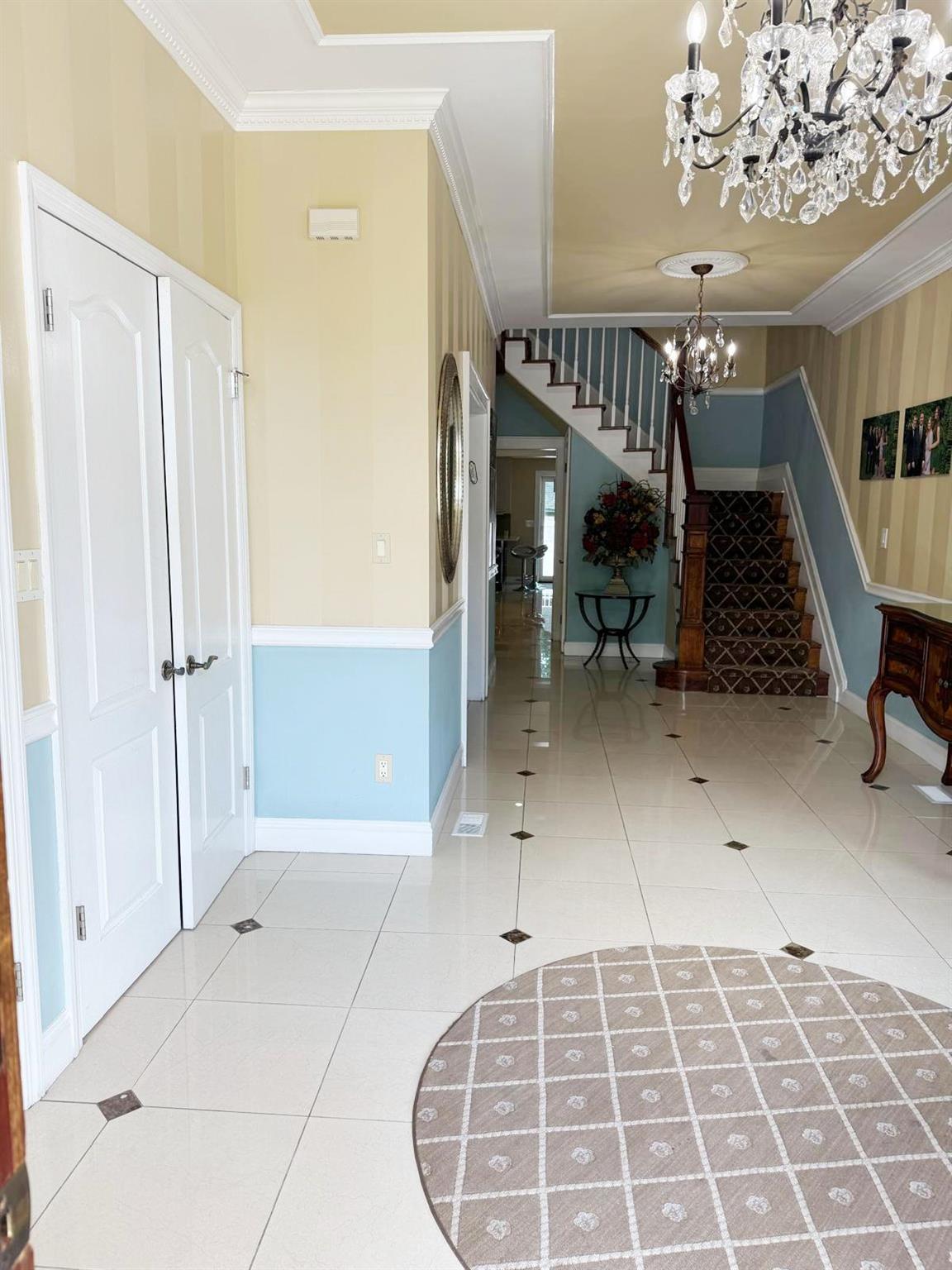 339 Midwood Road Woodmere, NY 11598 - Photo 4 of 49 a view of an entryway with a livingroom
