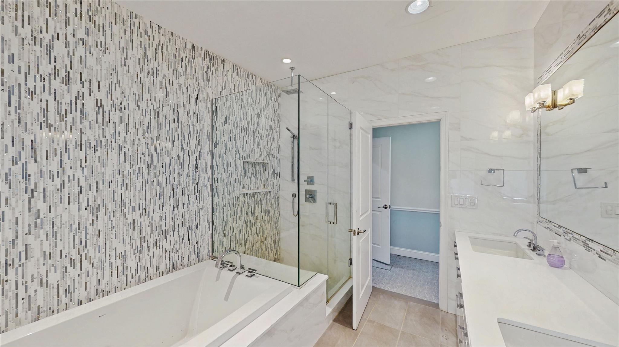 339 Midwood Road Woodmere, NY 11598 - Photo 42 of 49 a bathroom with a bathtub and a sink