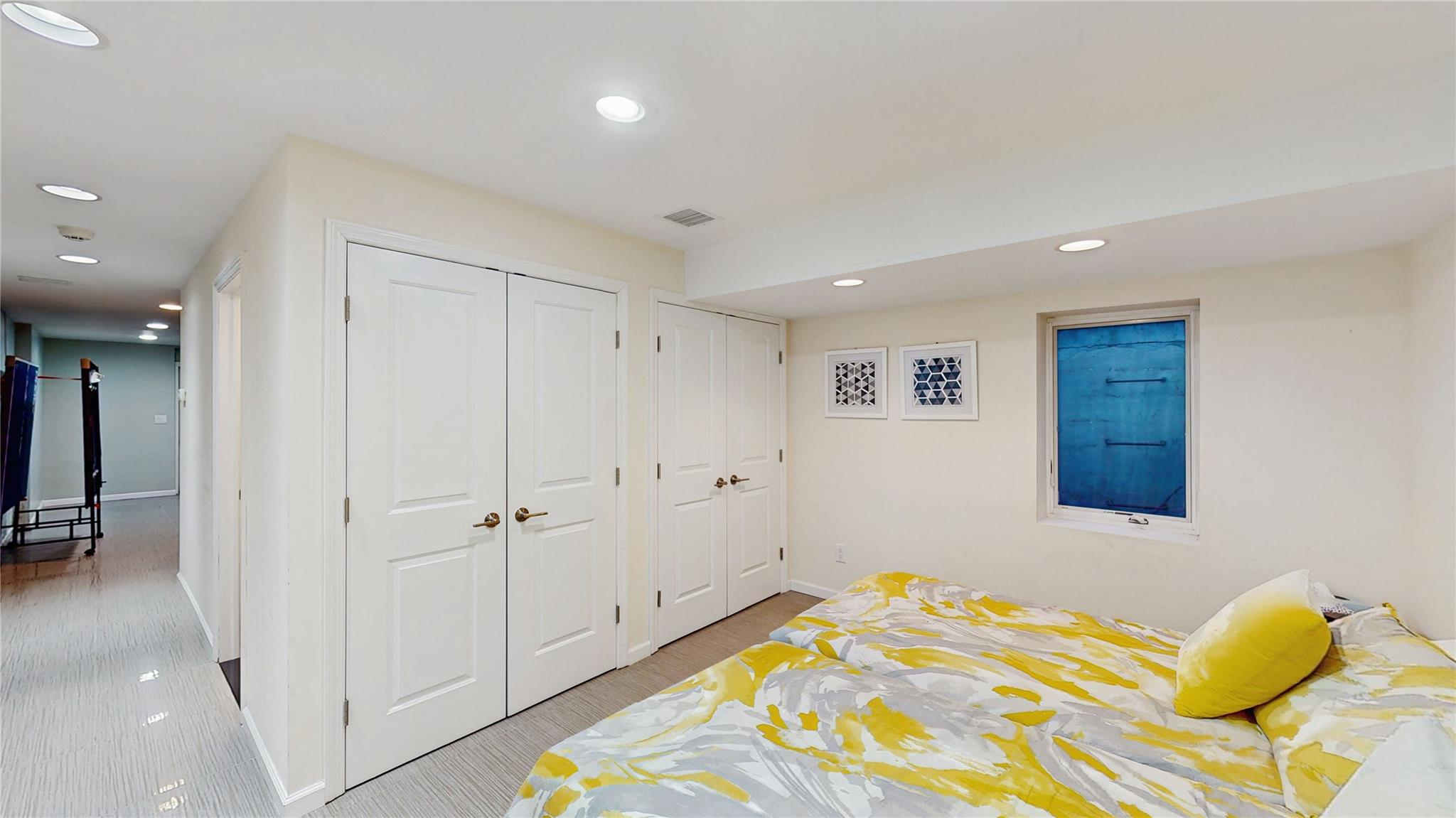 339 Midwood Road Woodmere, NY 11598 - Photo 45 of 49 a bedroom with a bed and a shower