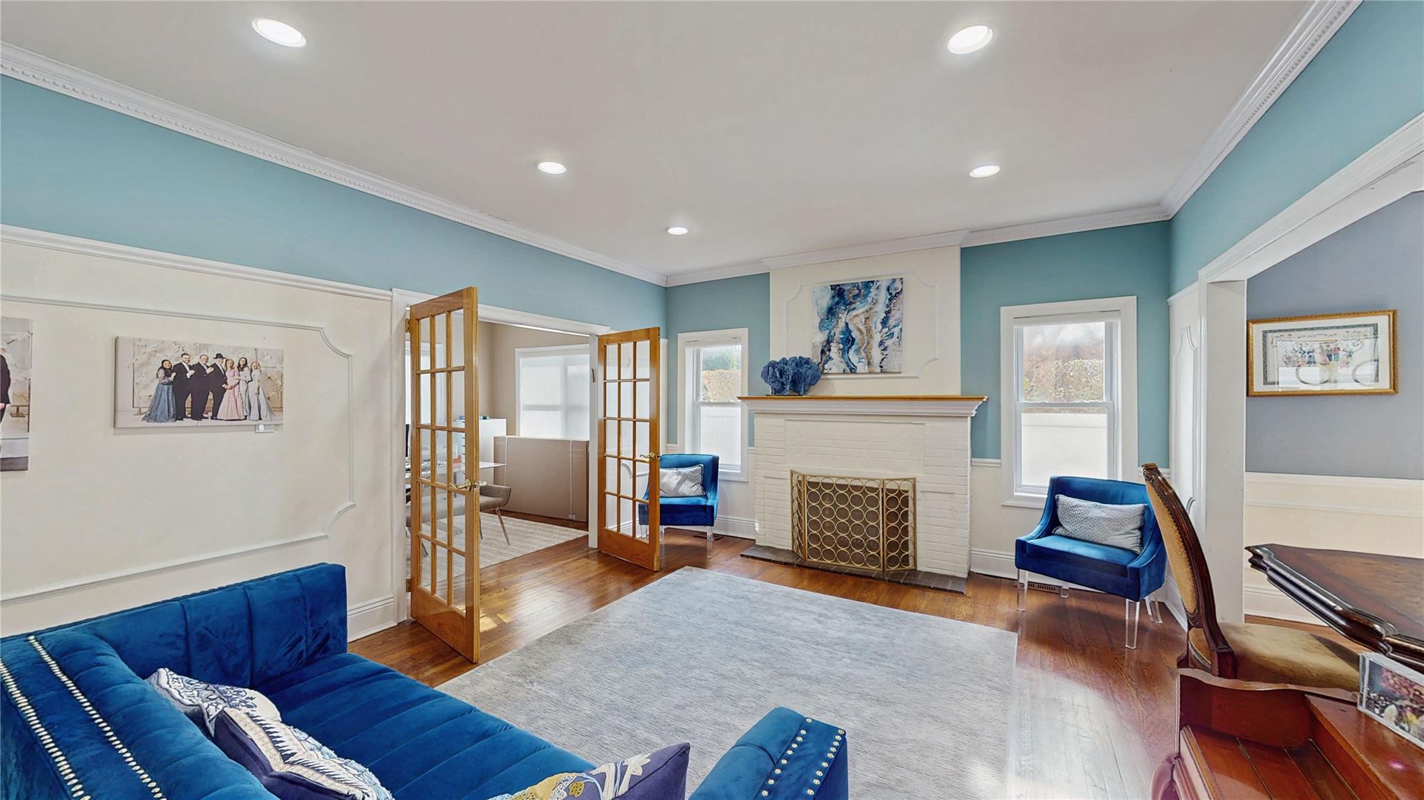 339 Midwood Road Woodmere, NY 11598 - Photo 7 of 49 a living room with furniture and a fireplace