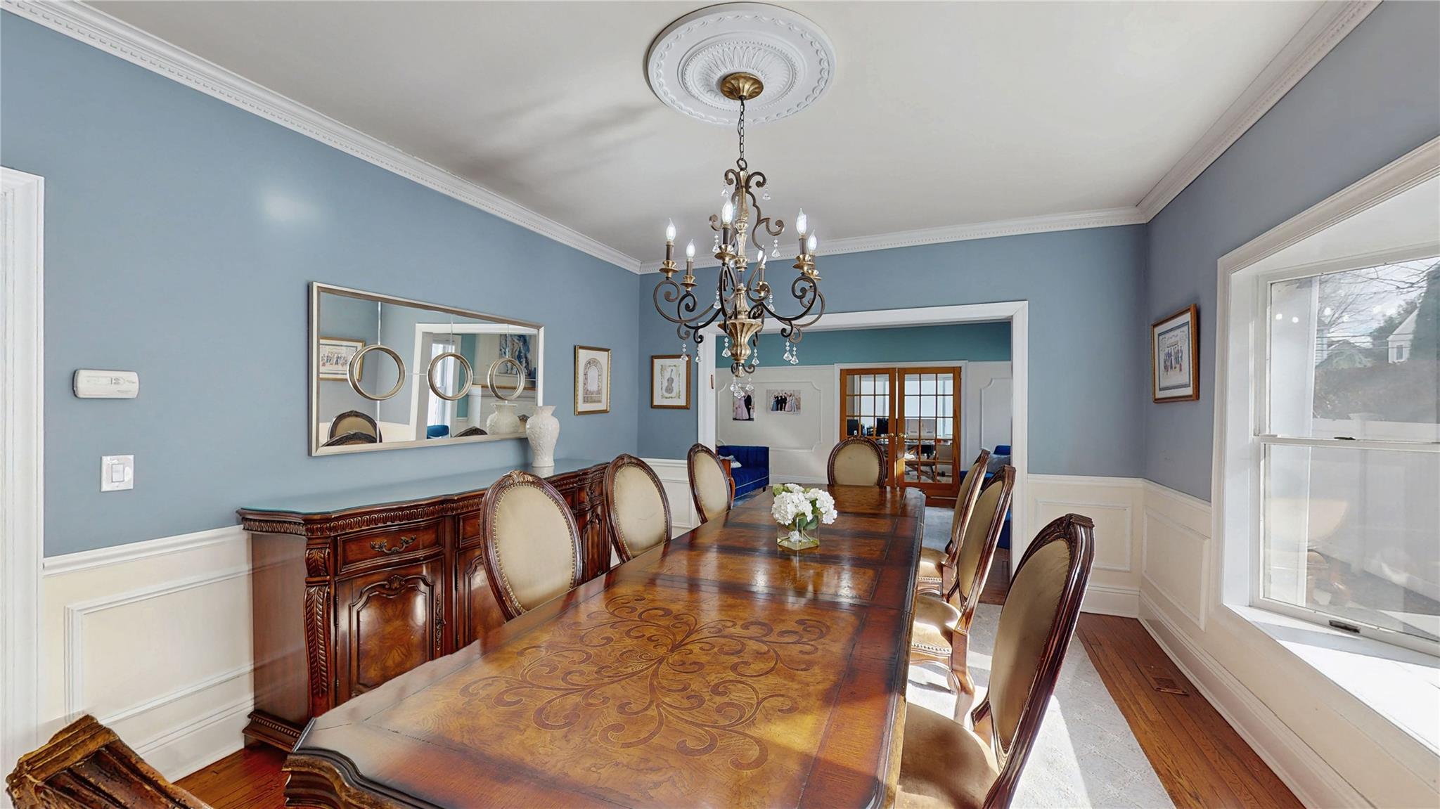 339 Midwood Road Woodmere, NY 11598 - Photo 10 of 49 a view of a dining room with furniture window and wooden floor
