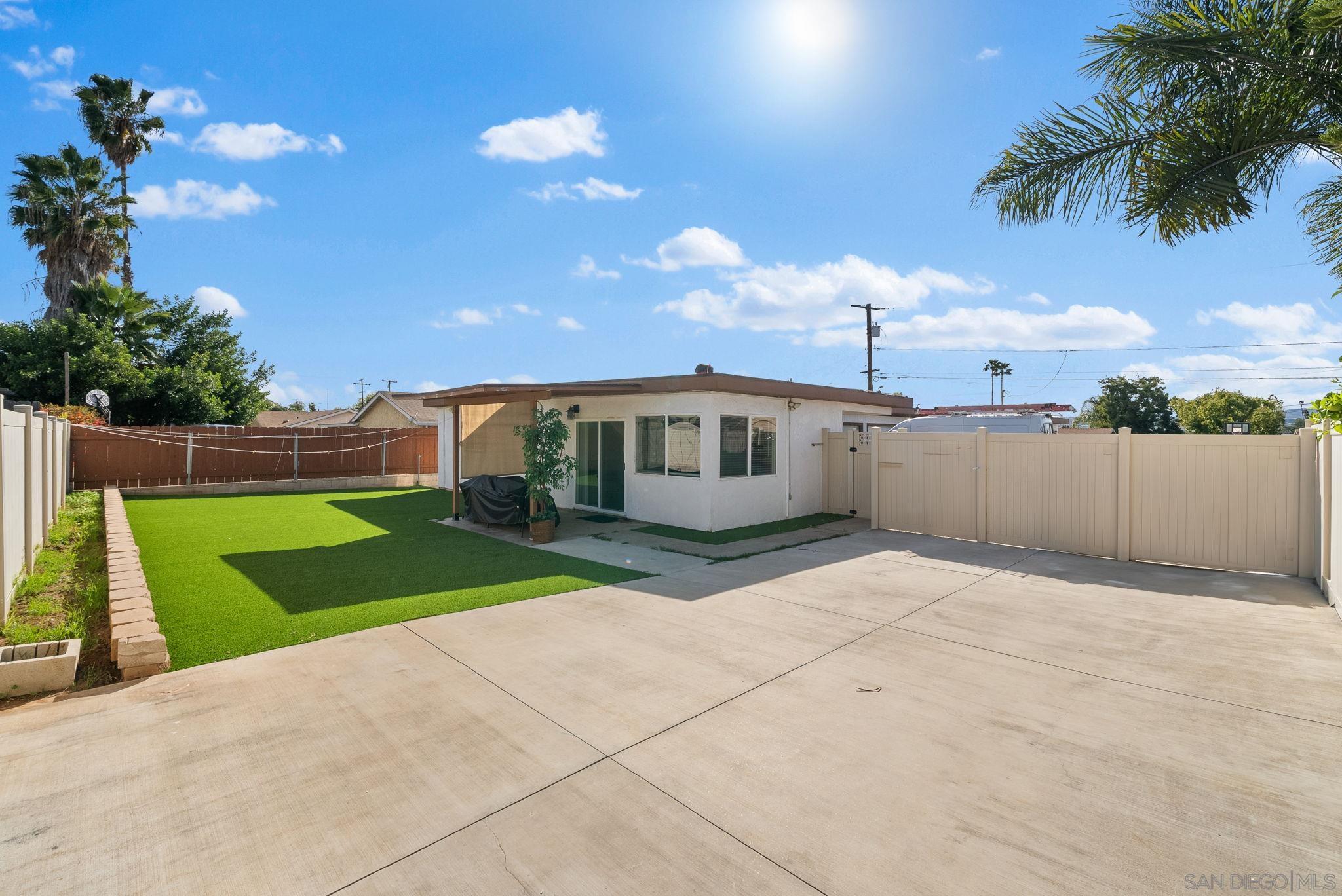 a view of a backyard of the house