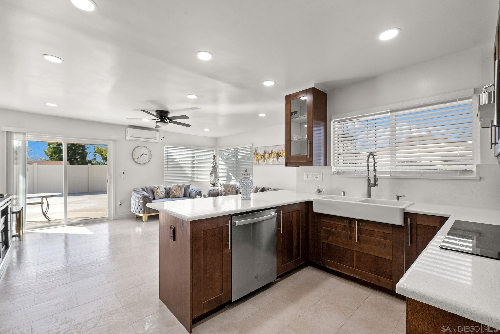 1407 5 D Drive El Cajon, CA 92021 - Photo 12 of 37 a large kitchen with a sink and cabinets