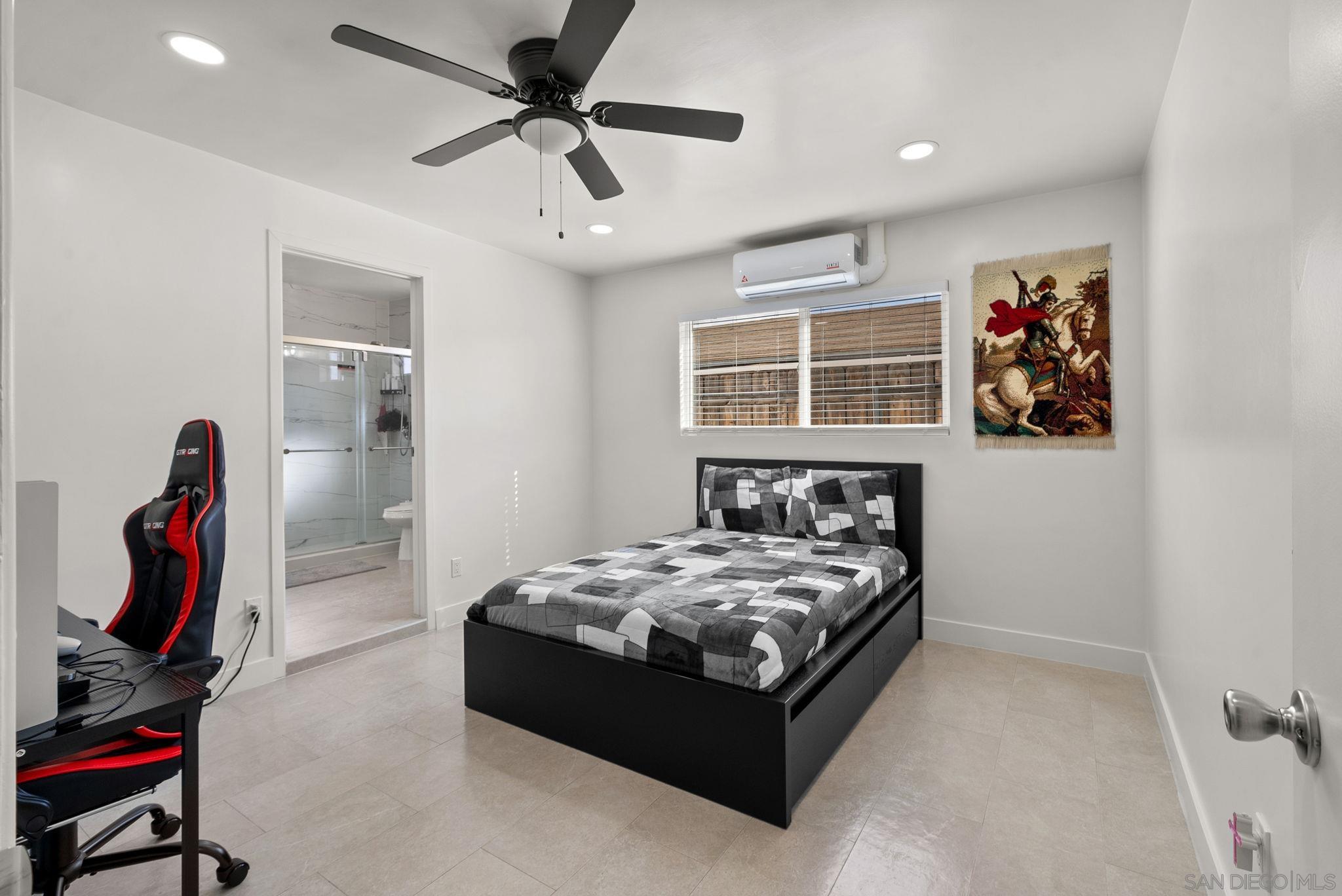 1407 5 D Drive El Cajon, CA 92021 - Photo 14 of 37 a bedroom with a bed and a window