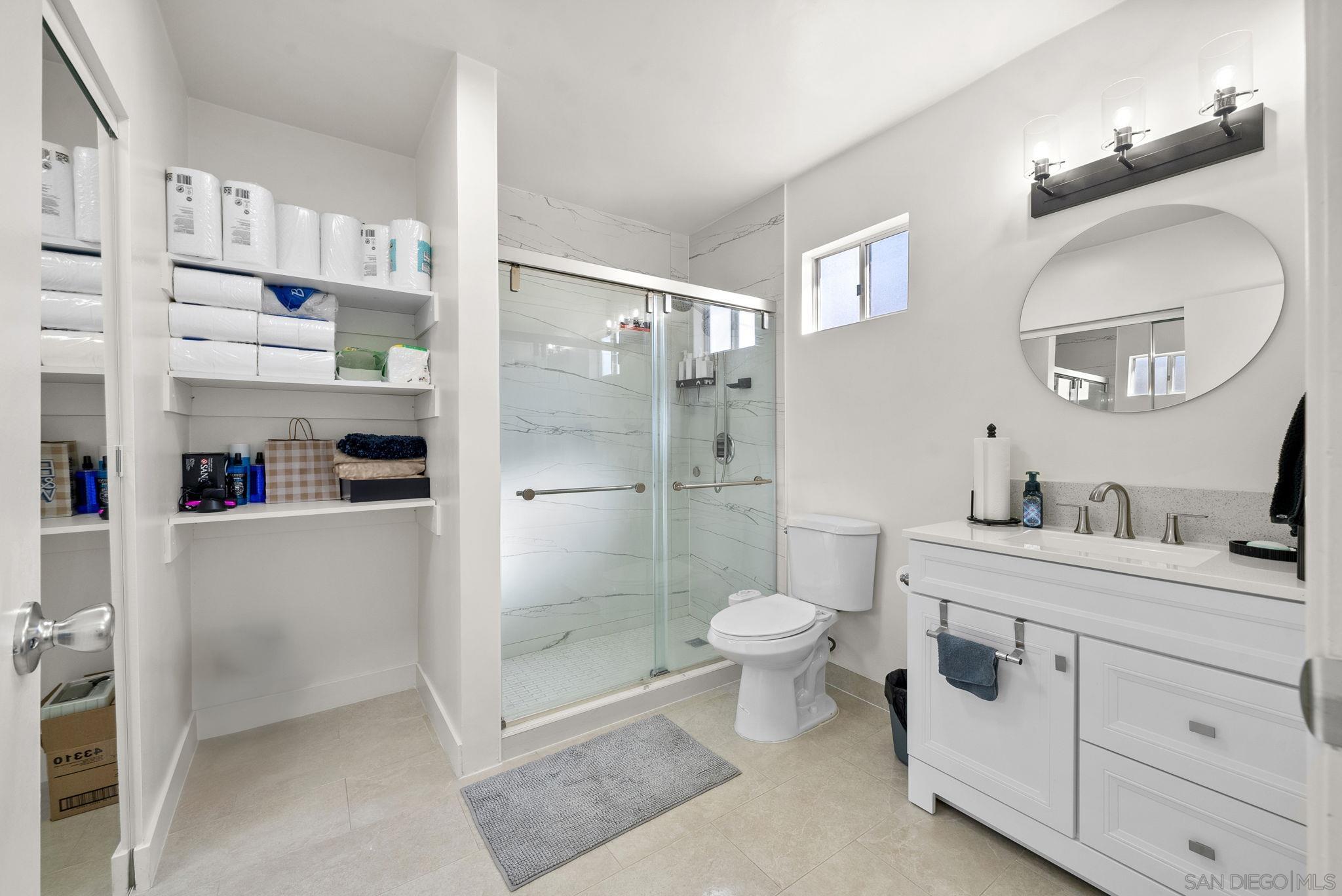 1407 5 D Drive El Cajon, CA 92021 - Photo 15 of 37 a bathroom with a double vanity sink toilet and shower