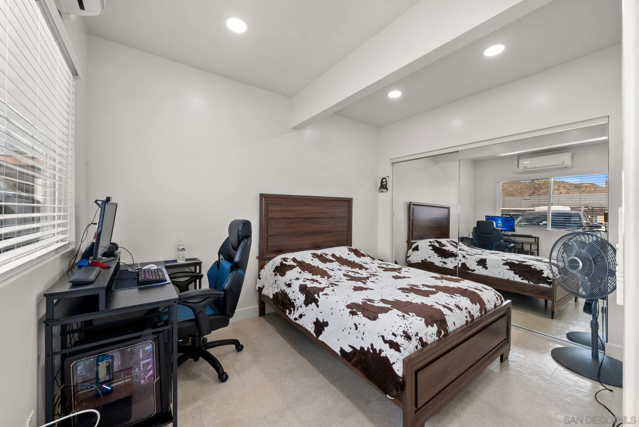 1407 5 D Drive El Cajon, CA 92021 - Photo 17 of 37 a bed room with bed and a window
