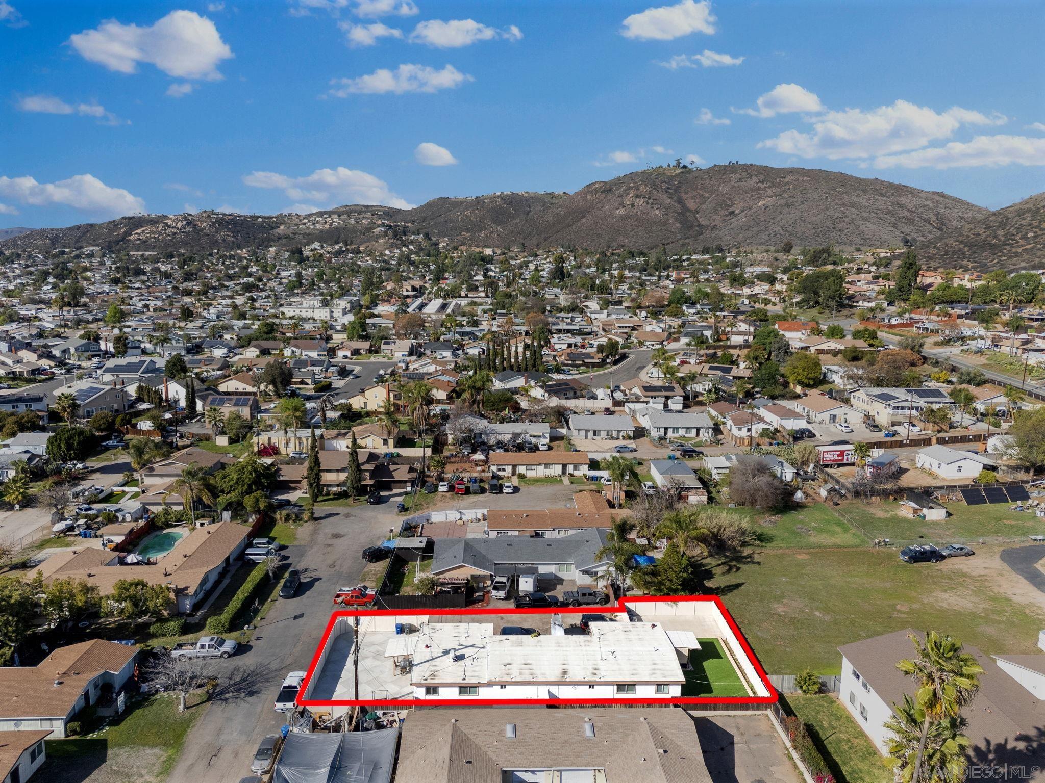 1407 5 D Drive El Cajon, CA 92021 - Photo 2 of 37 an aerial view of residential houses with outdoor space