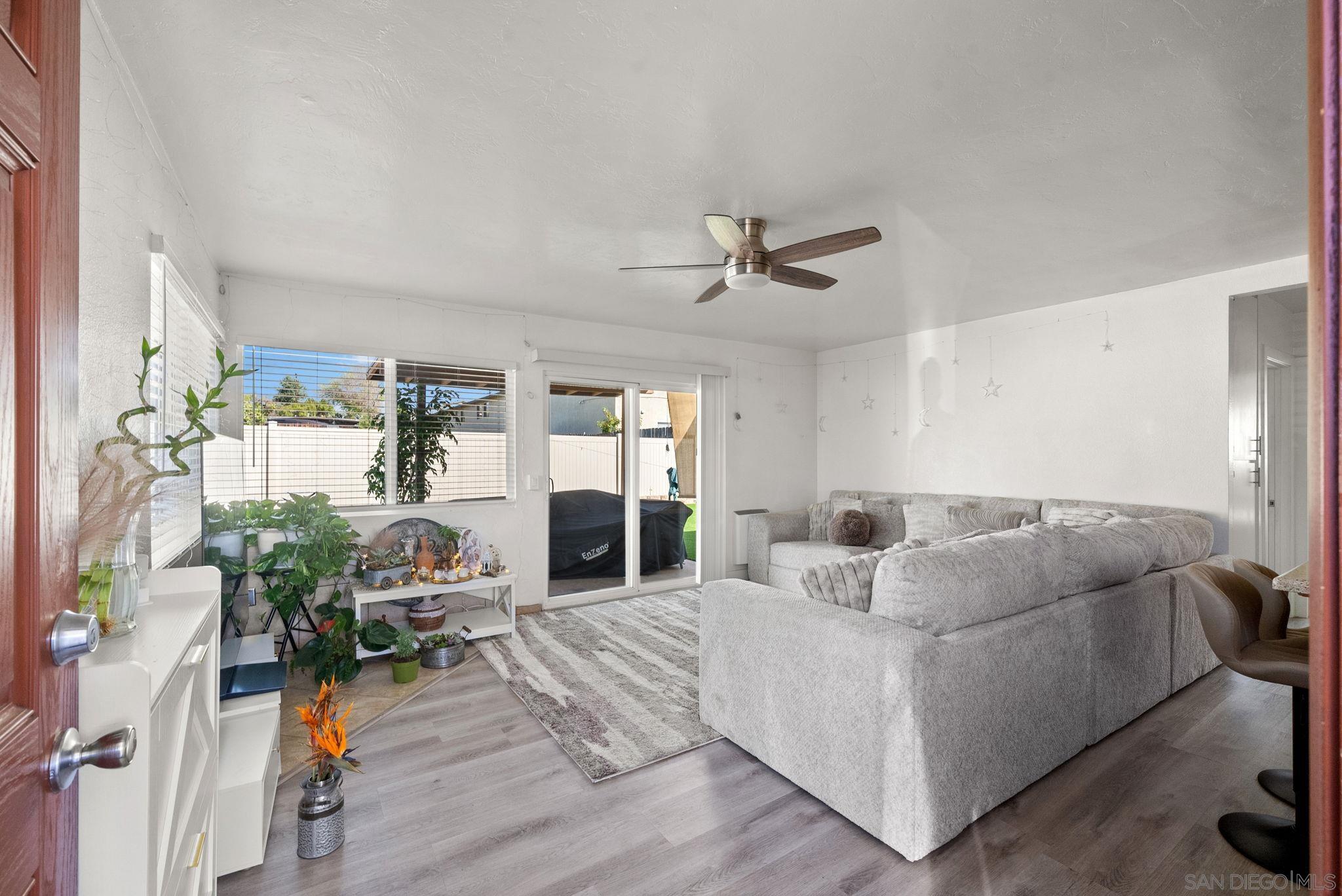 1407 5 D Drive El Cajon, CA 92021 - Photo 26 of 37 a living room with furniture and a wooden floor