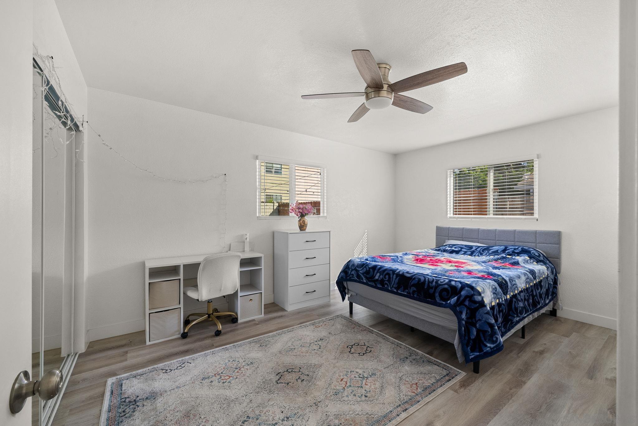 1407 5 D Drive El Cajon, CA 92021 - Photo 35 of 37 a spacious bedroom with a bed and a window
