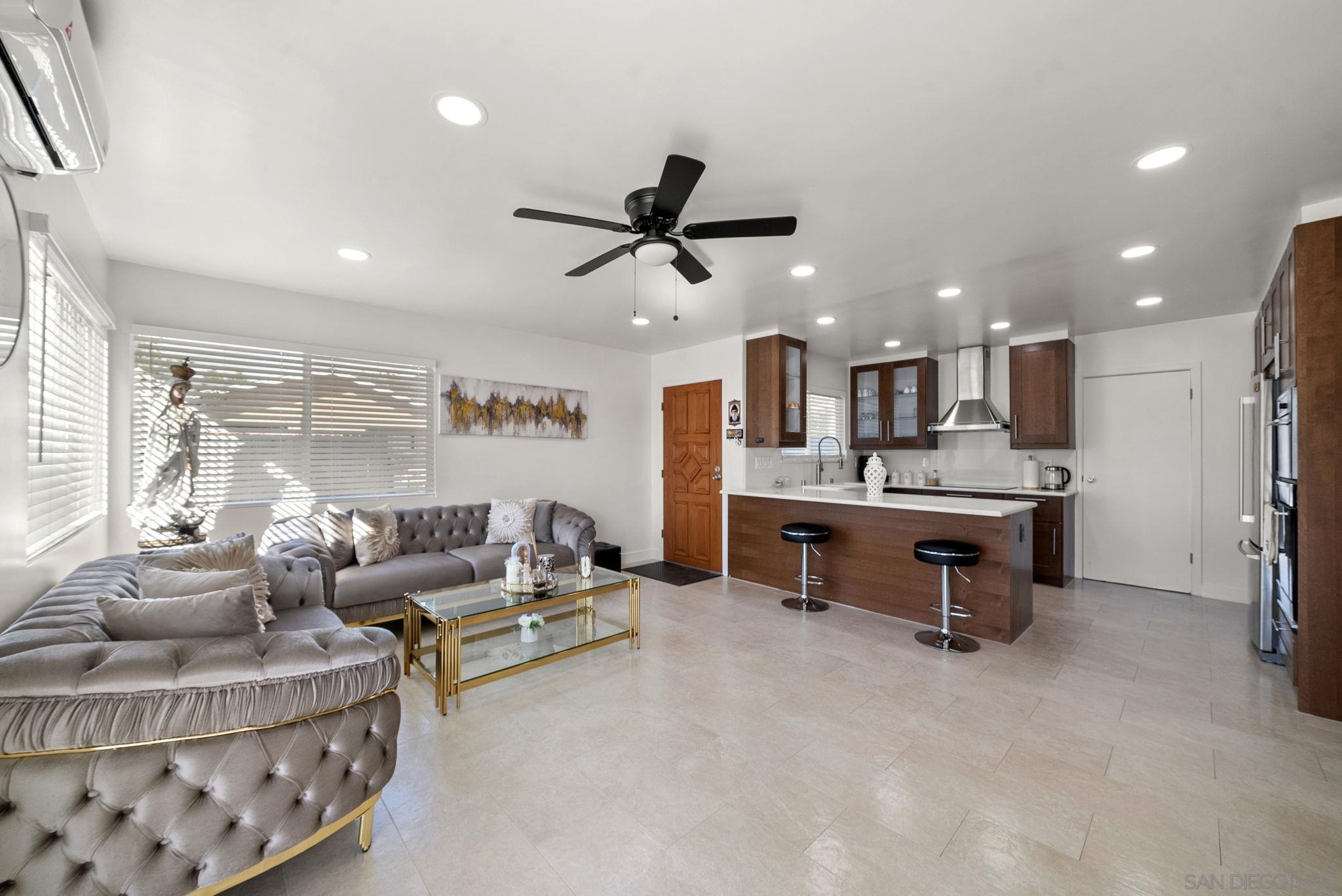 1407 5 D Drive El Cajon, CA 92021 - Photo 10 of 37 a living room with furniture and kitchen view