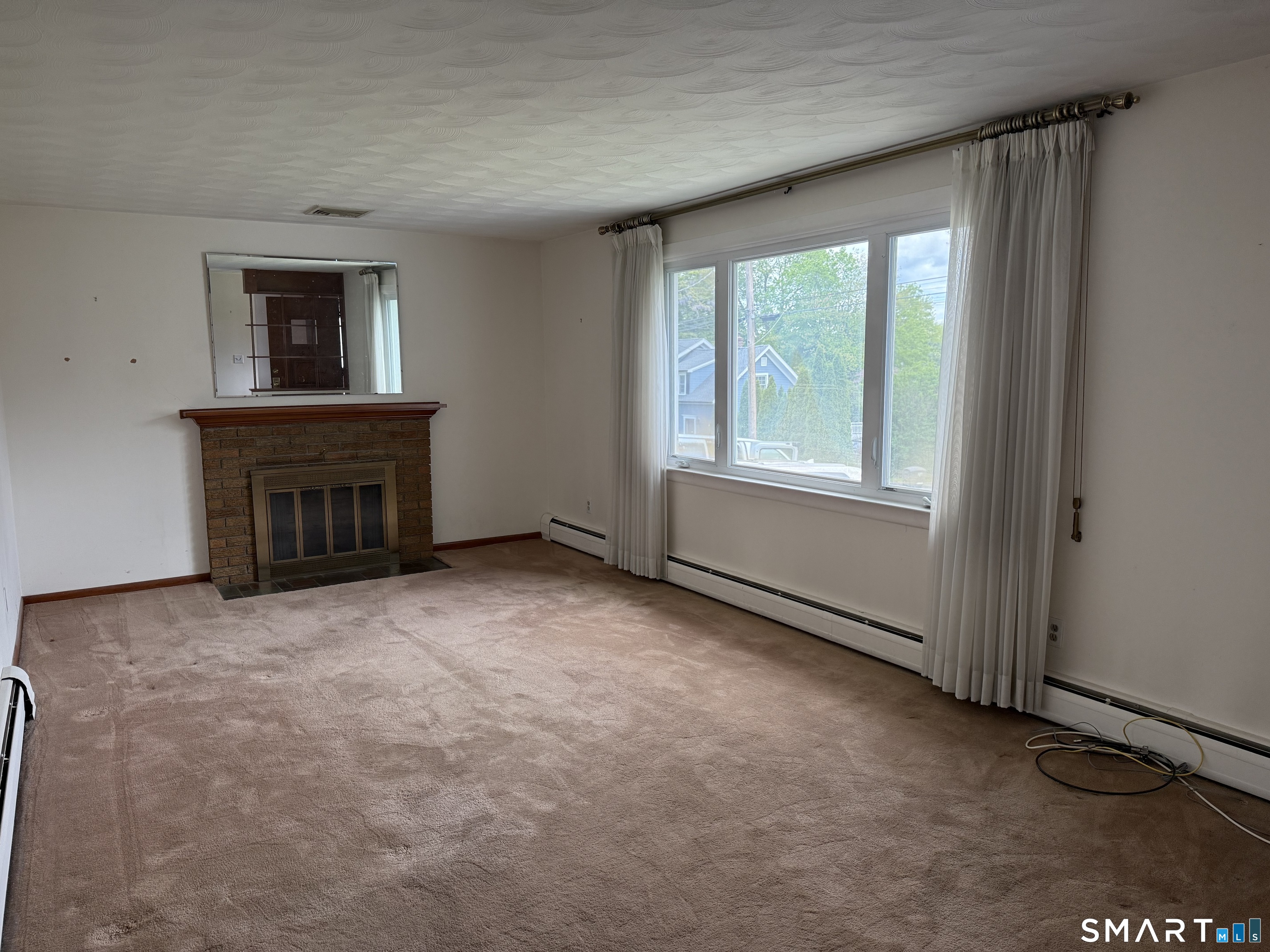 26 Maple Street Trumbull, CT 06611 - Photo 19 of 37 an empty room with windows and fireplace