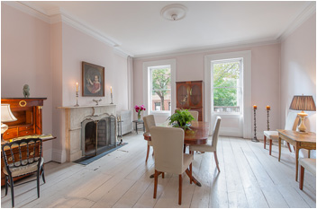 a view of a livingroom with furniture and a fireplace