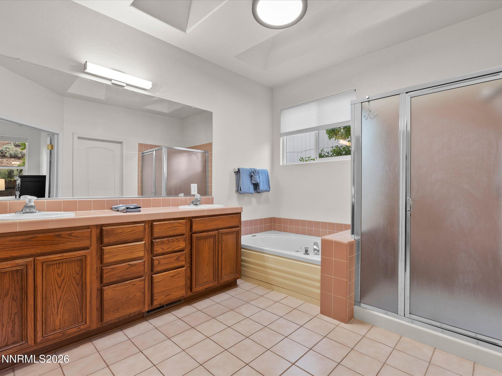 3101 Green River Drive Reno, NV 89503 - Photo 28 of 62 a spacious bathroom with a tub sink and mirror