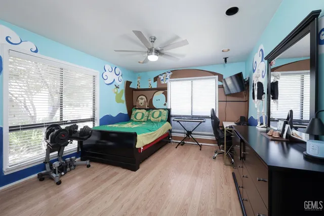 a bedroom with furniture and a window