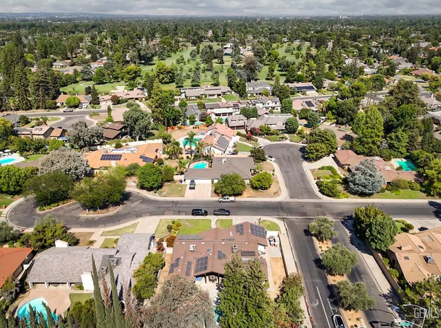 an aerial view of residential houses with outdoor space