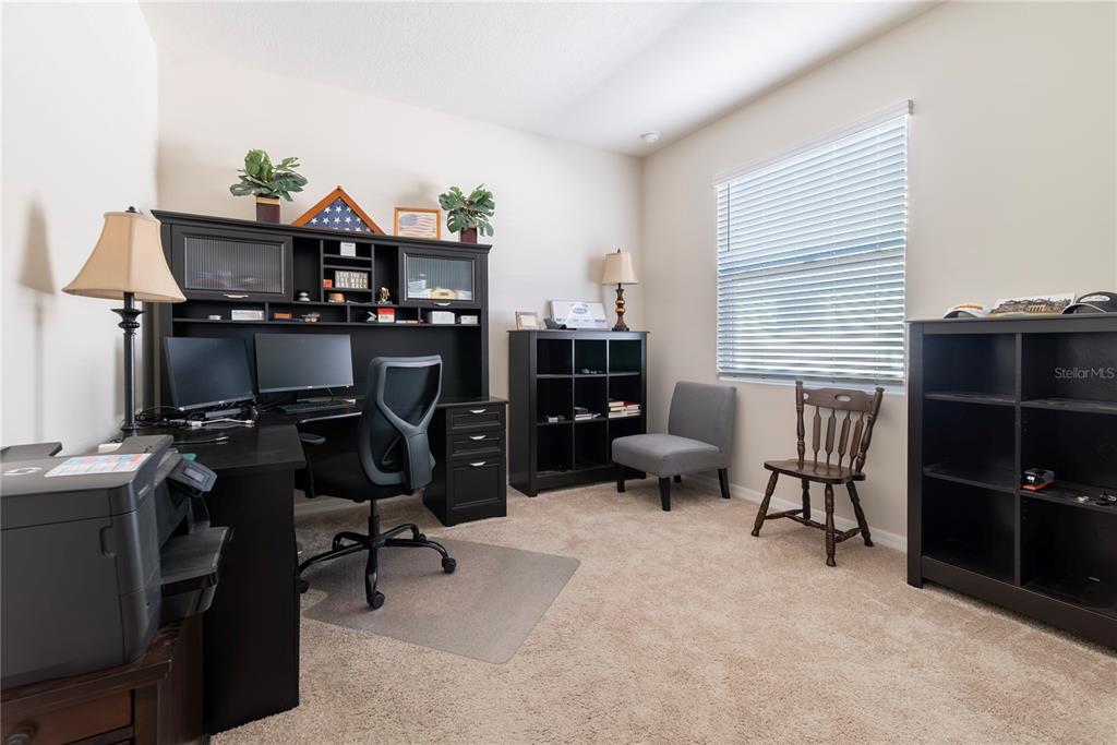 8284 Southwest 59th Terrace Ocala, FL 34476 - Photo 23 of 63 a view of a workspace with furniture and a window