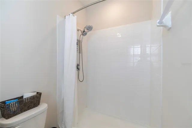 an aerial view of residential houses with outdoor space and swimming pool