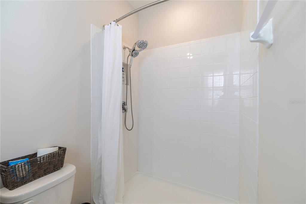 8284 Southwest 59th Terrace Ocala, FL 34476 - Photo 31 of 63 a bathroom with a granite countertop shower